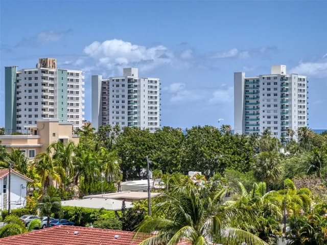 a view of an empty room and a window