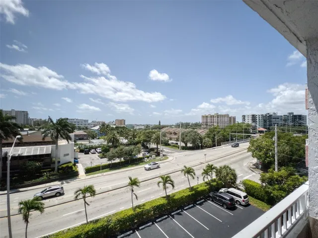 a view of balcony with furniture and city view