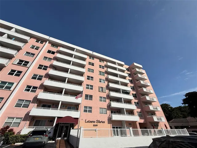 a view of a dining room with furniture and a flat screen tv