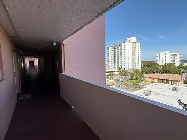 a kitchen with refrigerator and cabinets