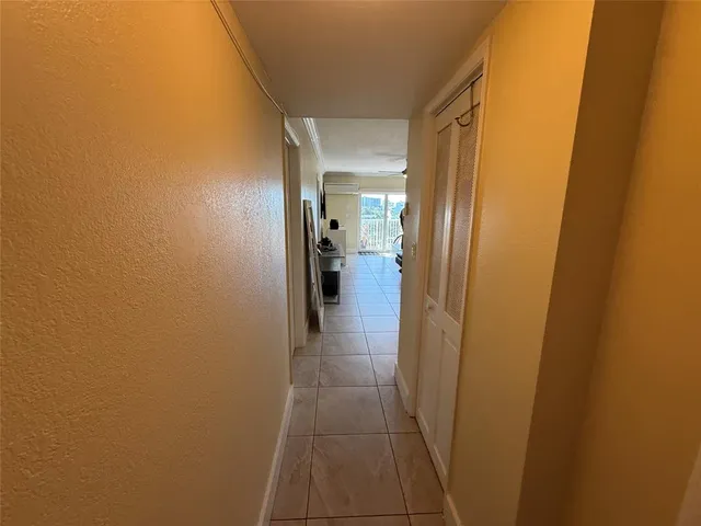 a view of a livingroom with furniture and a flat screen tv