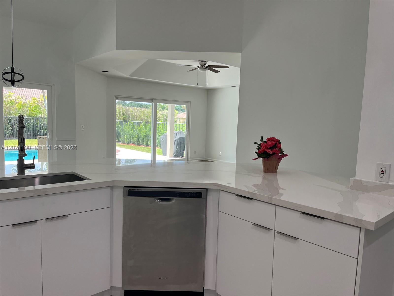 814 Heron Road Weston, FL 33326 - Photo 20 of 27 a kitchen with a sink and window