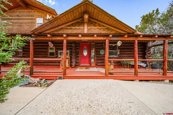 a view of a chairs and table in the patio