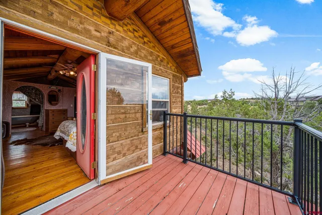 a view of balcony with wooden floor