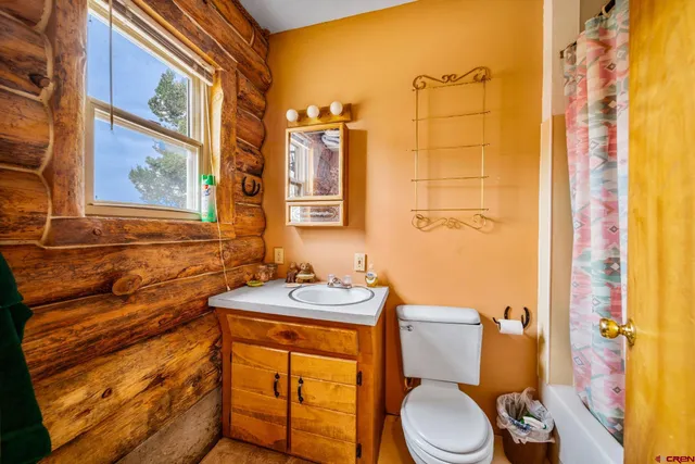 a view of a hallway with windows