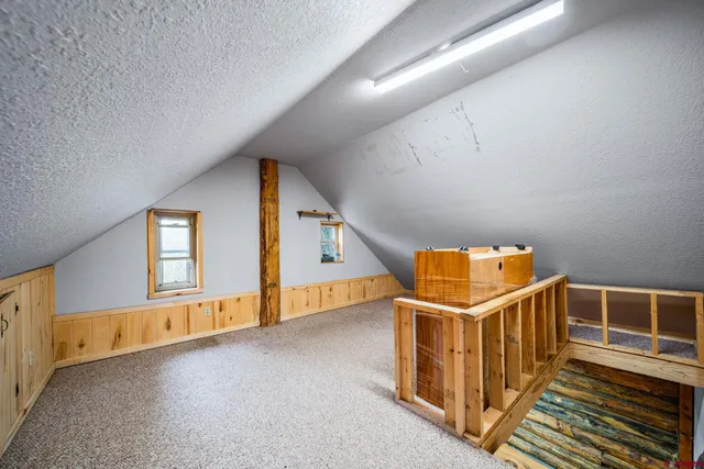 a view of a bedroom with window and a couch