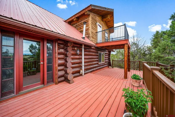 a view of balcony with wooden floor