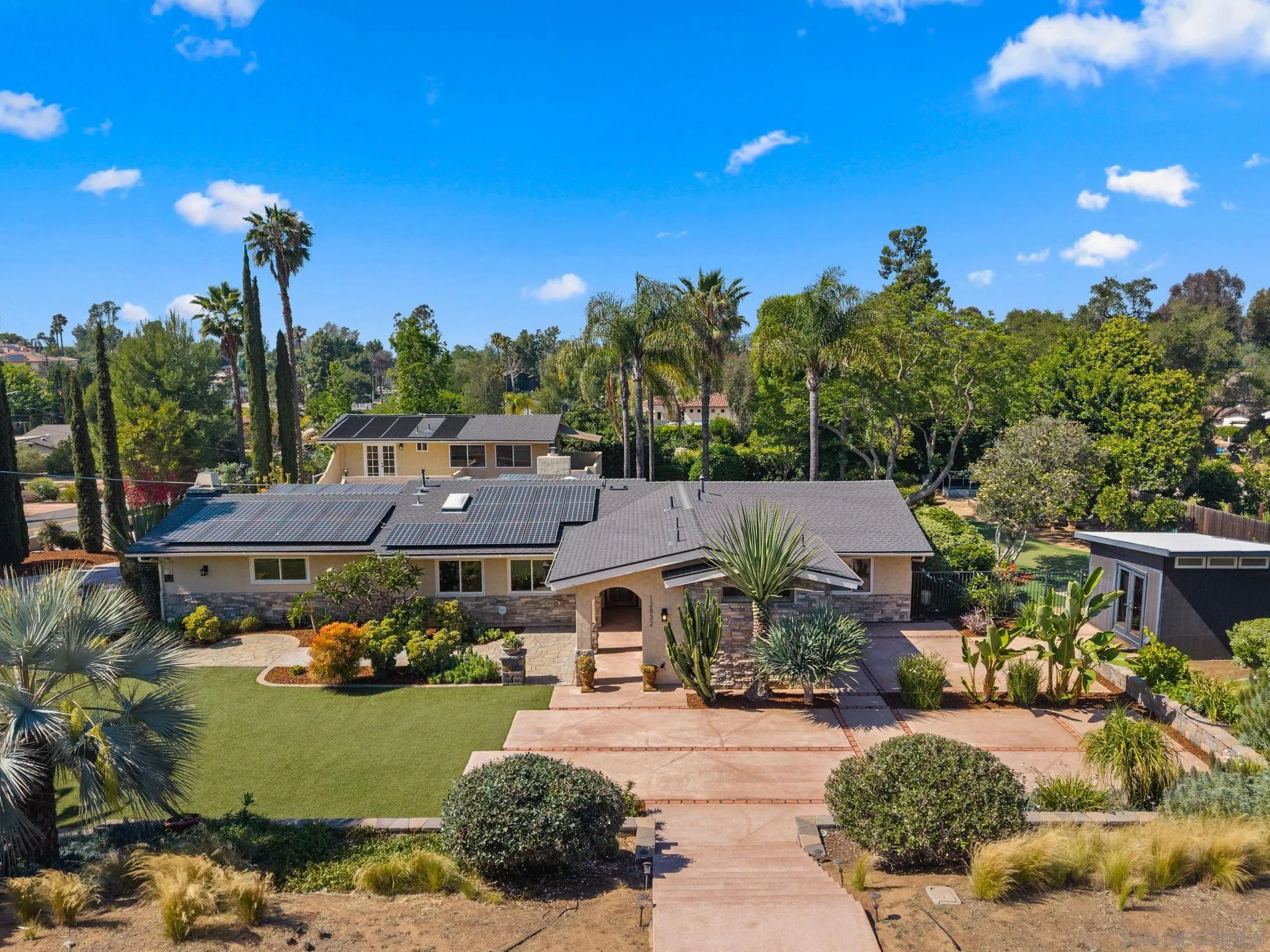 12832 Stone Canyon Road Poway, CA 92064 - Photo 53 of 60 a front view of a house with garden space and houses