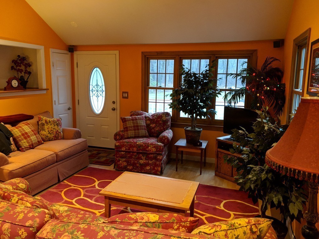 189 South Acton Road Stow, MA 01775 - Photo 8 of 21 a living room with furniture a lamp and a potted plant