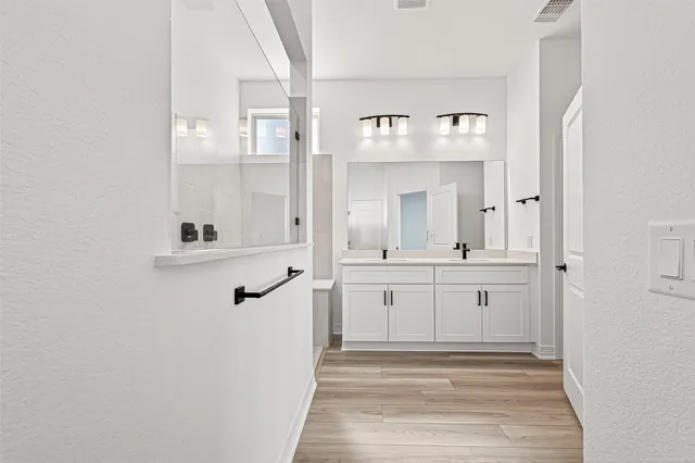 a bathroom with a sink and mirror