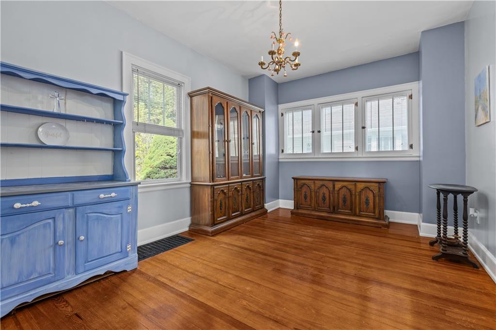 512 Regent Street Houston, PA 15342 - Photo 14 of 29 a spacious bedroom with a bed and a chandelier
