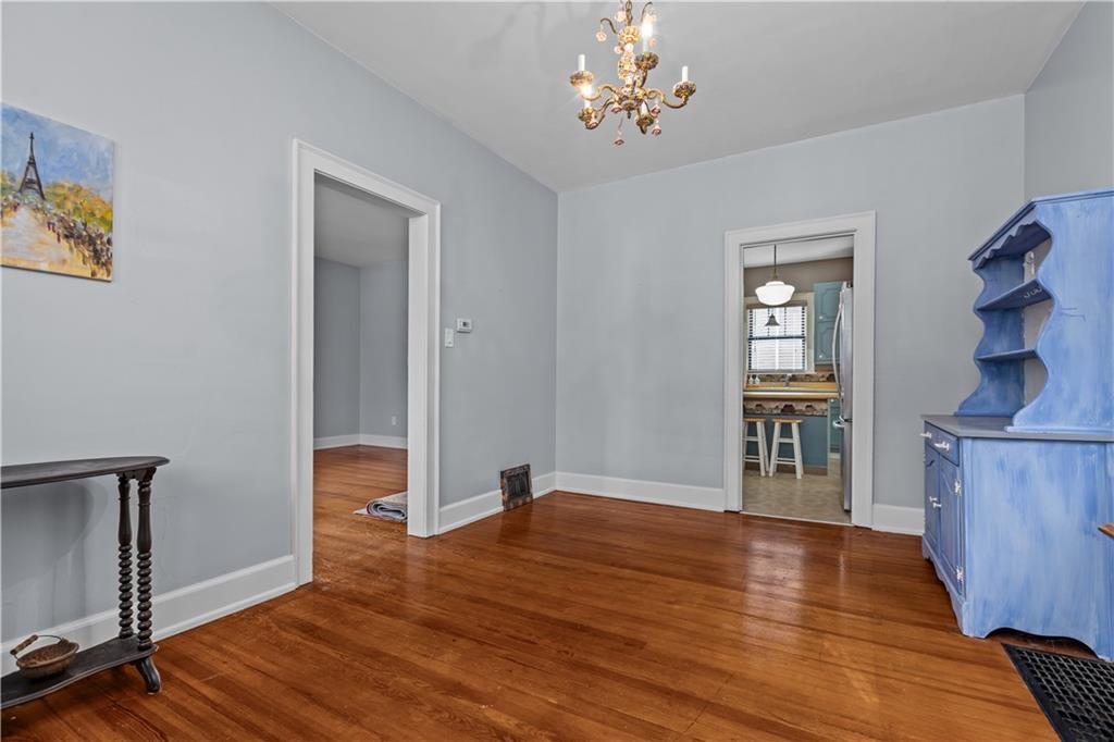 512 Regent Street Houston, PA 15342 - Photo 15 of 29 a view of empty room with wooden floor and fan