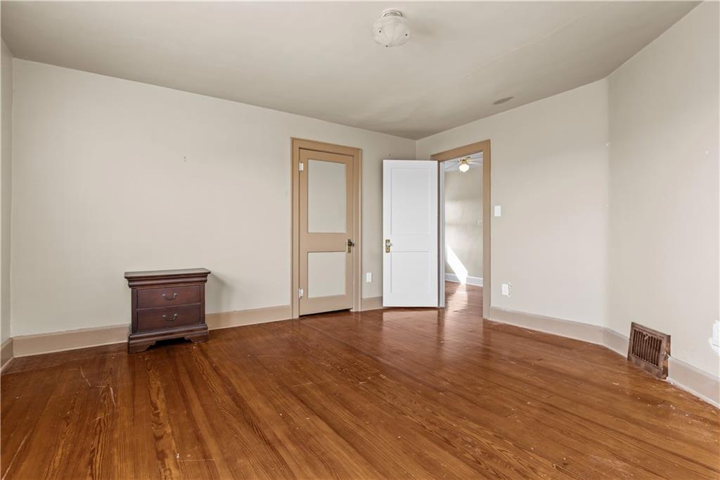 512 Regent Street Houston, PA 15342 - Photo 19 of 29 an empty room with wooden floor and windows