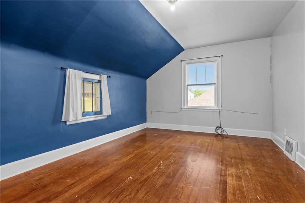 512 Regent Street Houston, PA 15342 - Photo 22 of 29 a view of an empty room with window and wooden floor