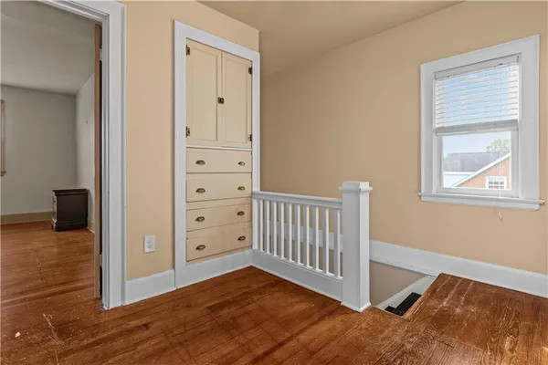 a view of a backyard with large trees