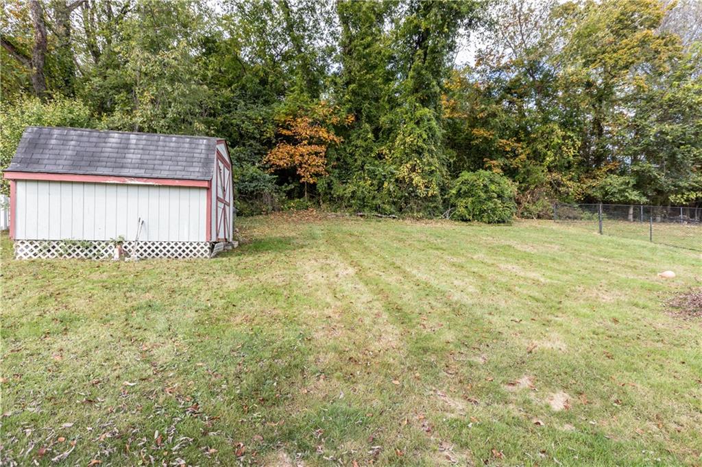 512 Regent Street Houston, PA 15342 - Photo 28 of 29 a view of a backyard with large trees