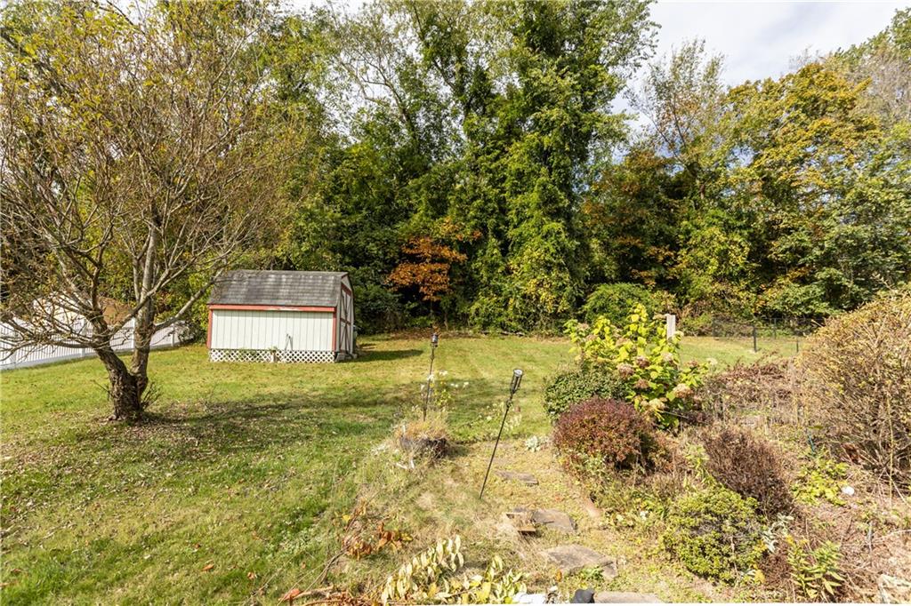 512 Regent Street Houston, PA 15342 - Photo 29 of 29 a yellow building in the middle of a yard