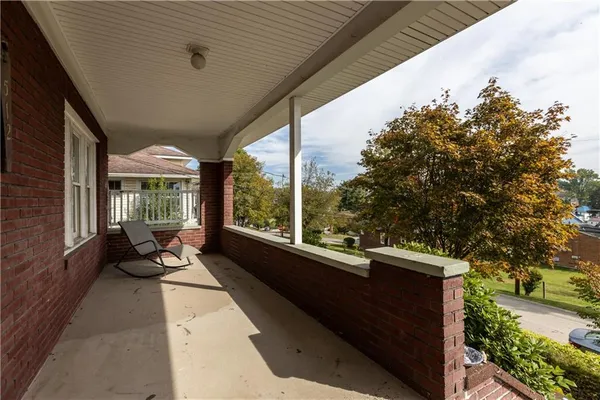 a view of a two chairs in the balcony
