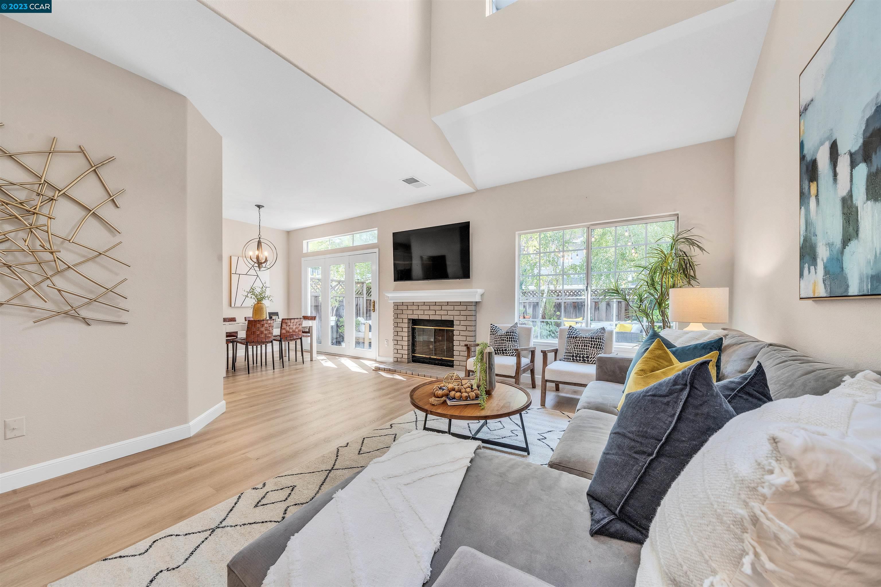 23 Copperfield Lane Danville, CA 94506 - Photo 1 of 1 a living room with furniture a fireplace and a flat screen tv