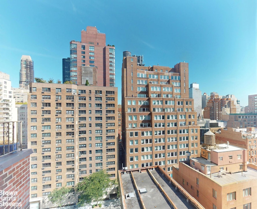 301 East 62nd Street, Unit 14B Manhattan, NY 10065 - Photo 2 of 14 a view of a city with tall buildings