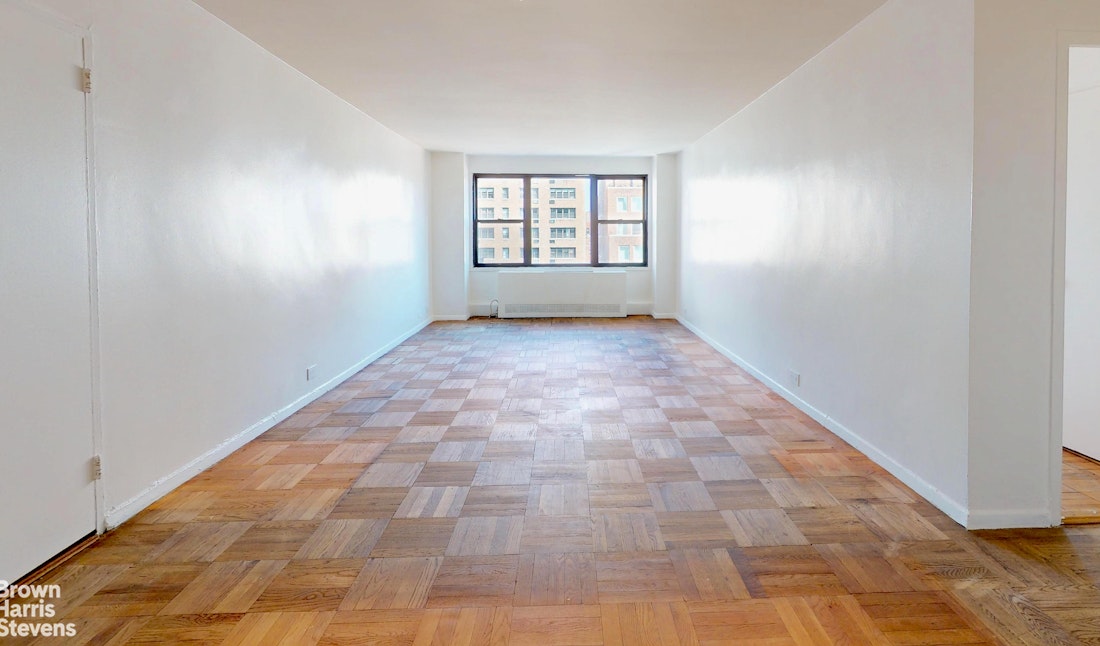301 East 62nd Street, Unit 14B Manhattan, NY 10065 - Photo 3 of 14 a view of an empty room and window