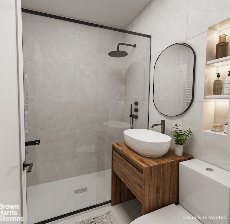 301 East 62nd Street, Unit 14B Manhattan, NY 10065 - Photo 8 of 14 a bathroom with a sink toilet and shower