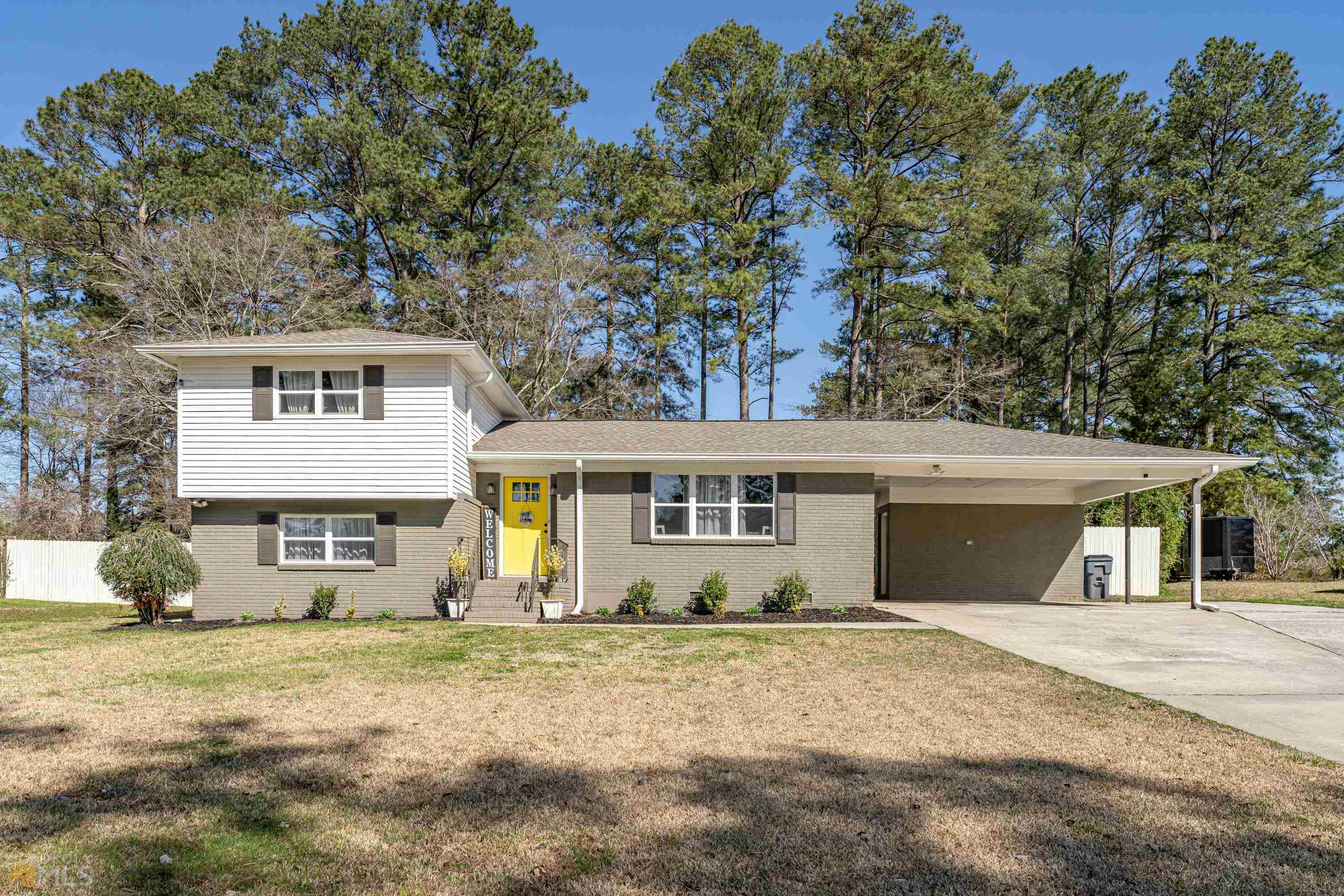 a front view of a house with a yard