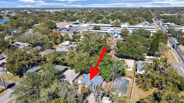 a picture of a room with a white wall and a refrigerator