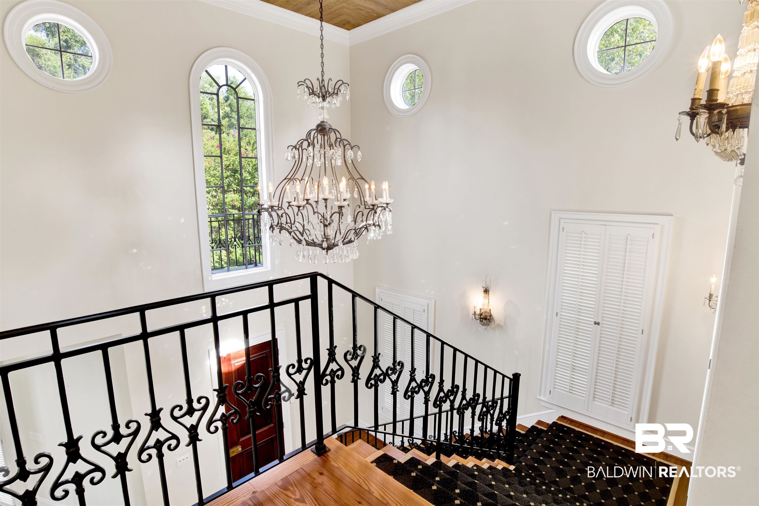 3816 Austill Lane Mobile, AL 36608 - Photo 11 of 80 Stairway with a chandelier, wood finished floors, and ornamental molding
