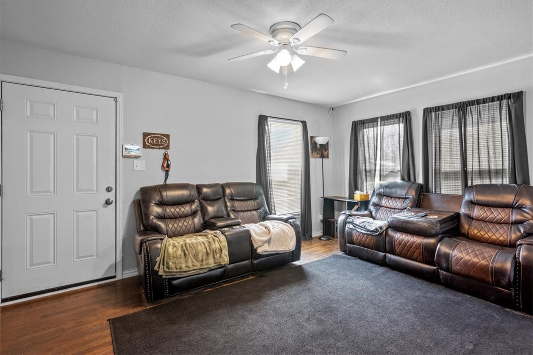 502 Bales Street Cleburne, TX 76033 - Photo 6 of 20 a bed room with couch and a window