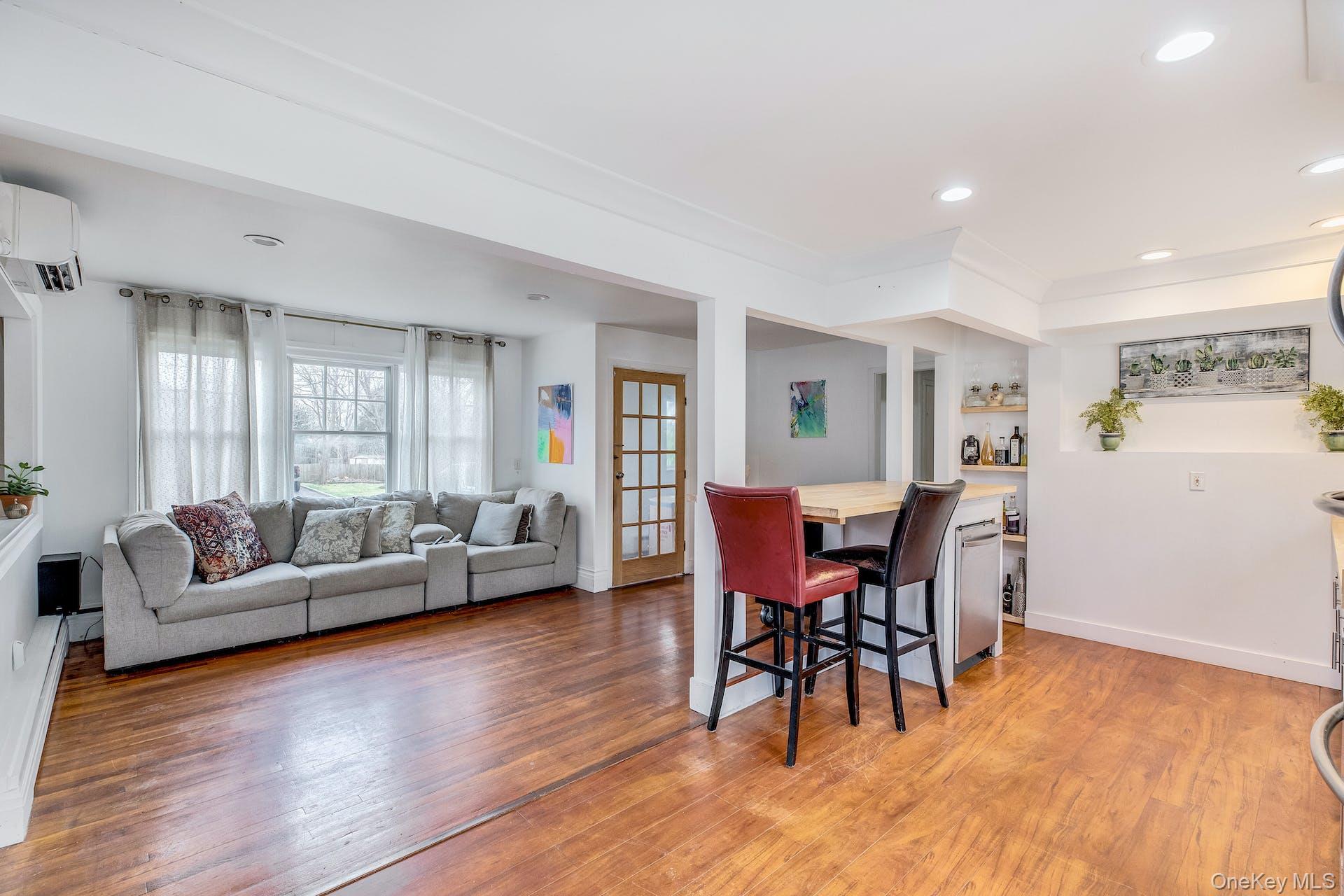 7 George Street Hampton Bays, NY 11946 - Photo 5 of 11 Kitchen dining area and living room