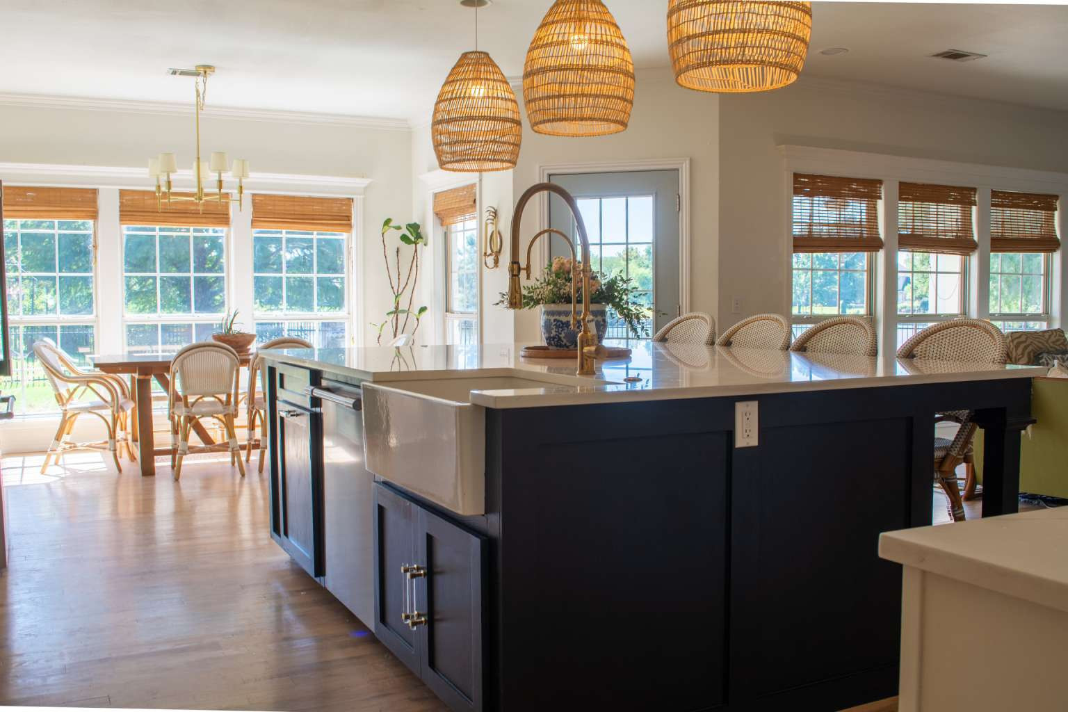 115 South Forest Ridge Boulevard Broken Arrow, OK 74014 - Photo 12 of 50 Kitchen island with dark cabinetry, integrated farmhouse sink, and polished countertop