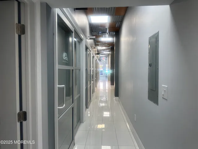 a bathroom with a toilet sink a mirror and vanity