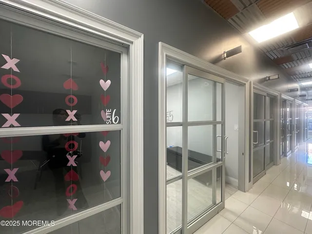 a bathroom with a shower and a sink