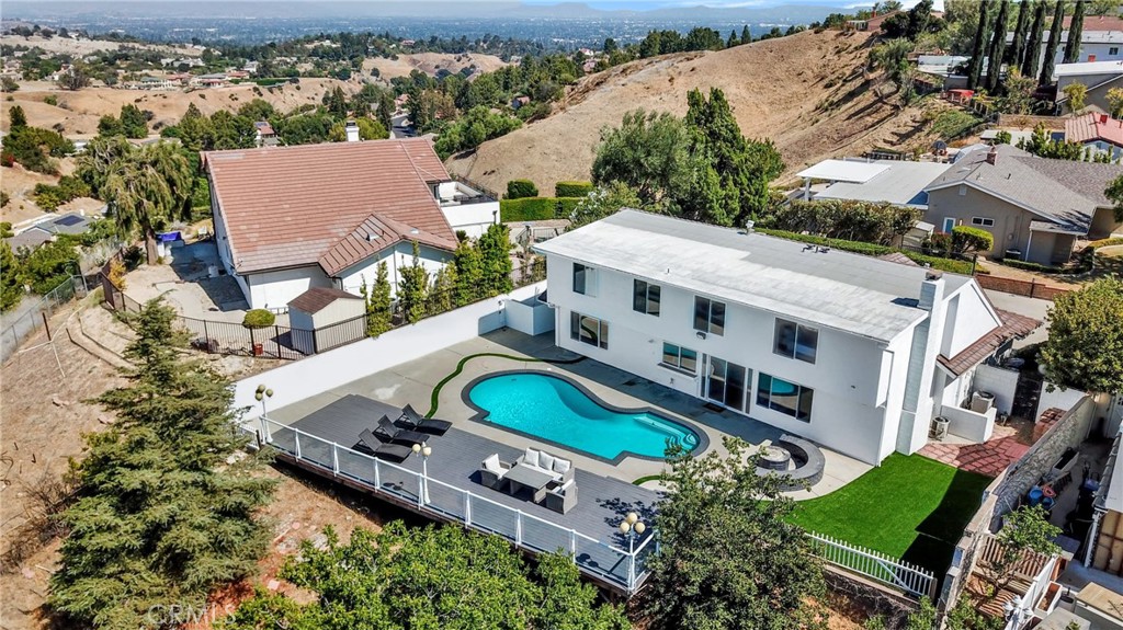 an aerial view of a house with a garden