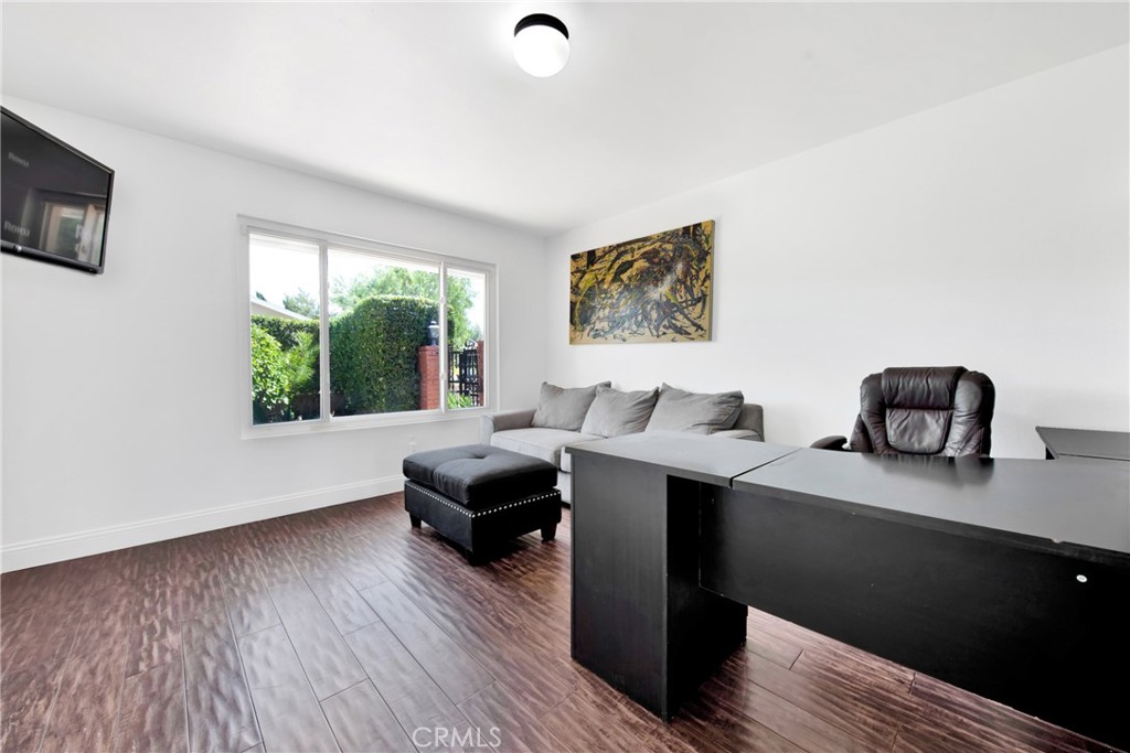12036 Darby Avenue Porter Ranch, CA 91326 - Photo 19 of 37 a living room with furniture window and wooden floor
