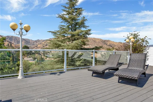 a view of a balcony with chairs