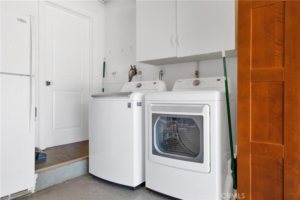 12036 Darby Avenue Porter Ranch, CA 91326 - Photo 35 of 37 a utility room with dryer and washer