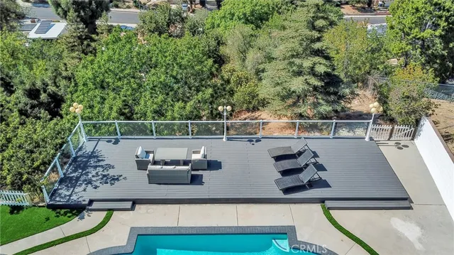 a view of a swimming pool with a patio