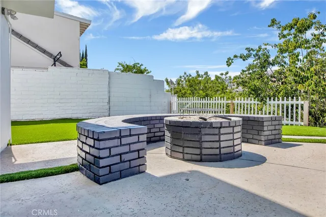 a view of a swimming pool with a back yard