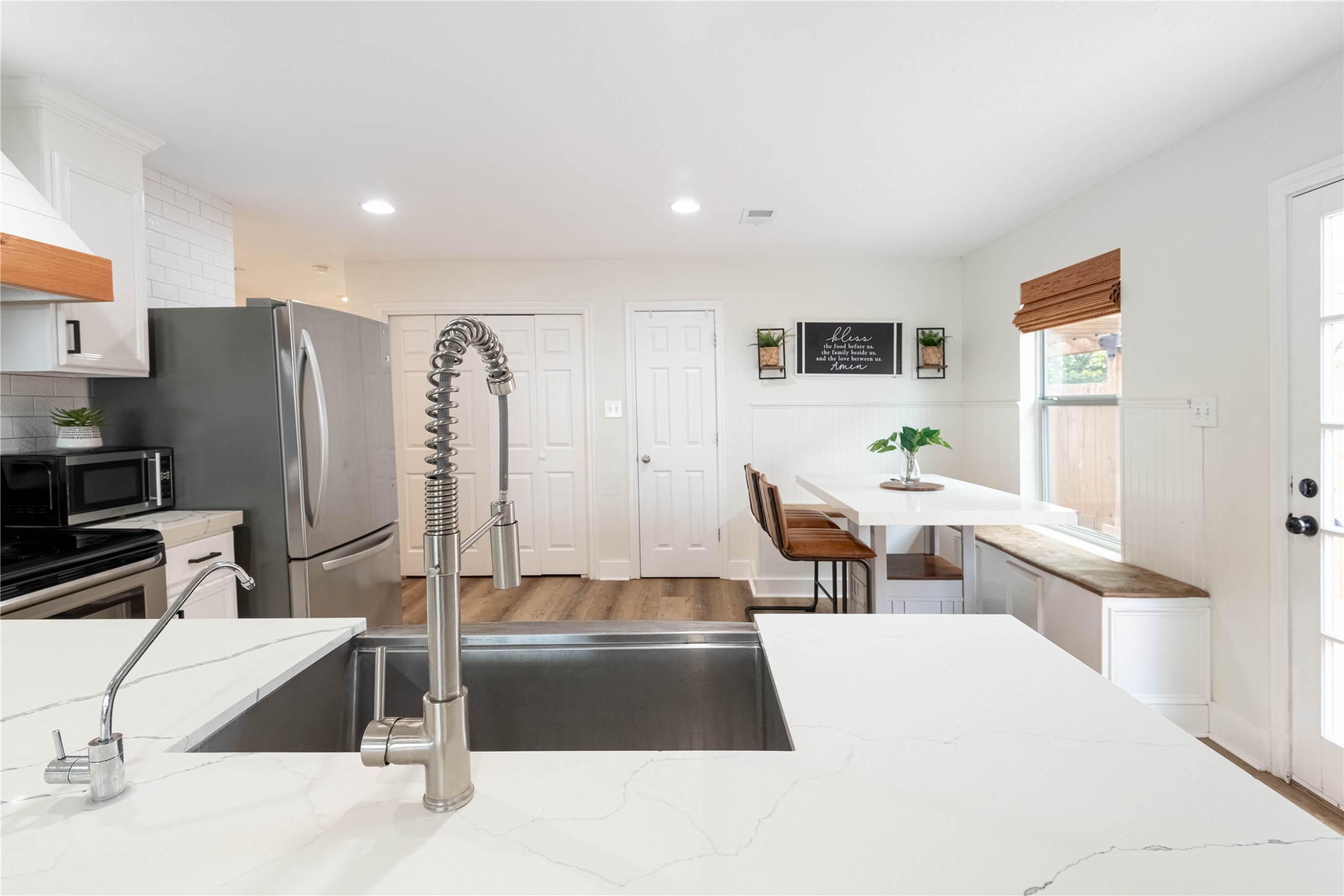2031 7th Street Hempstead, TX 77445 - Photo 14 of 30 a living room with stainless steel appliances kitchen island granite countertop furniture and a refrigerator