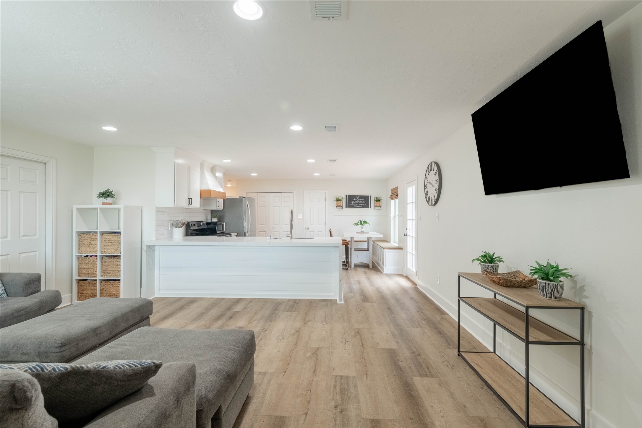 2031 7th Street Hempstead, TX 77445 - Photo 15 of 30 a living room with furniture and a flat screen tv