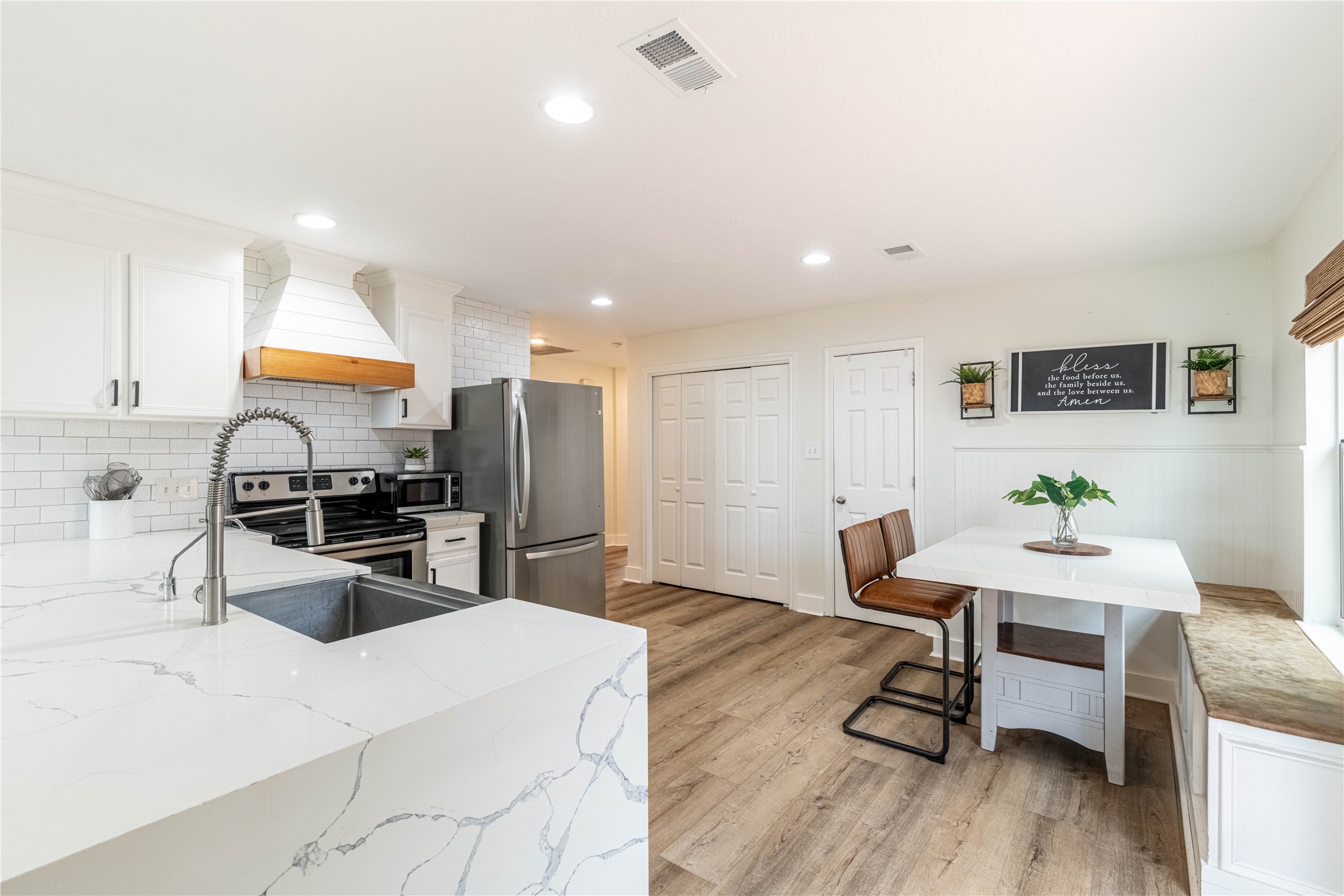 2031 7th Street Hempstead, TX 77445 - Photo 16 of 30 a kitchen with sink cabinets and wooden floor