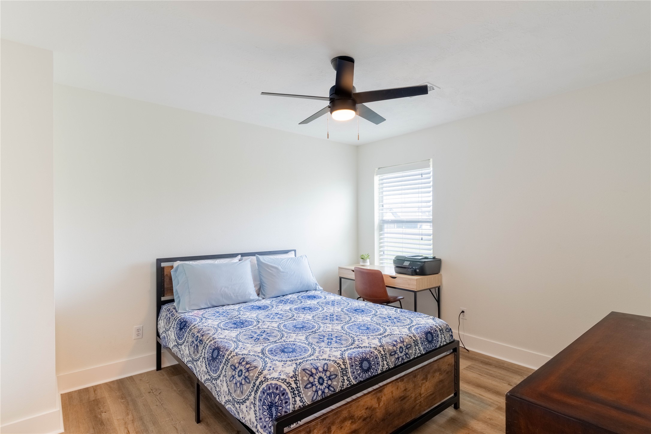2031 7th Street Hempstead, TX 77445 - Photo 22 of 30 a bedroom with a bed and window