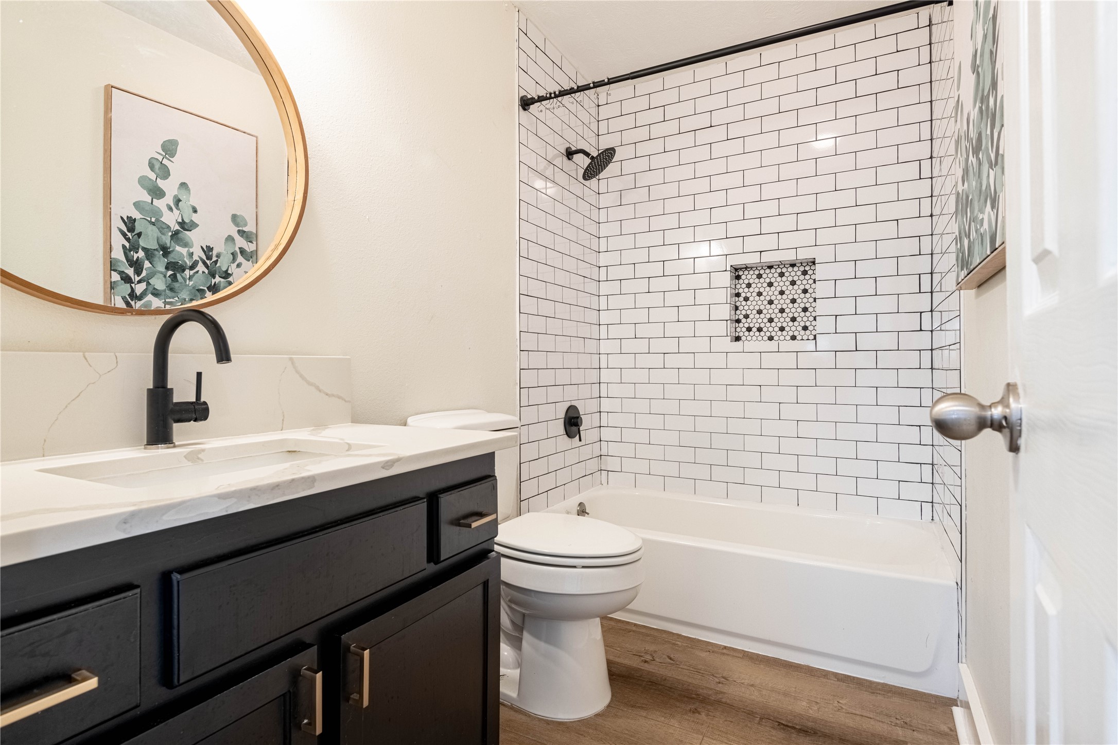 2031 7th Street Hempstead, TX 77445 - Photo 24 of 30 a bathroom with a sink a toilet and a mirror
