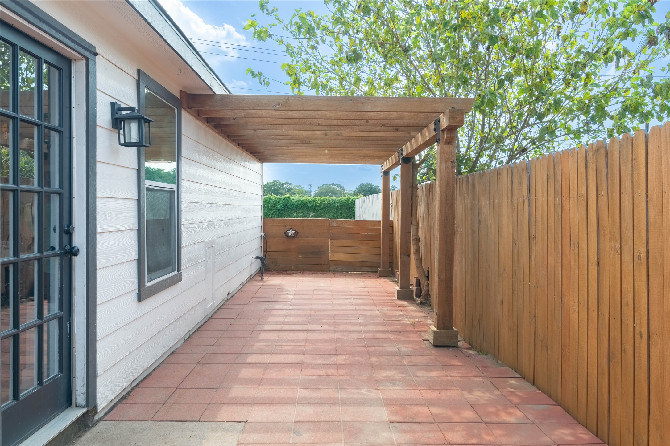 2031 7th Street Hempstead, TX 77445 - Photo 25 of 30 a view of backyard with tub