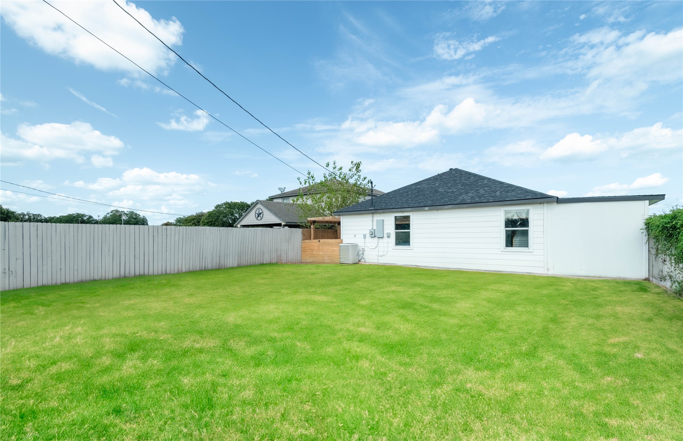 2031 7th Street Hempstead, TX 77445 - Photo 27 of 30 a view of a yard in front of a house