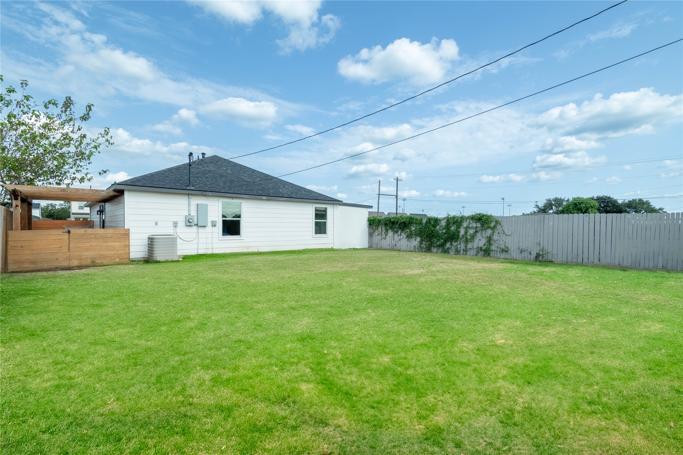 2031 7th Street Hempstead, TX 77445 - Photo 28 of 30 a front view of a house with a yard and garage