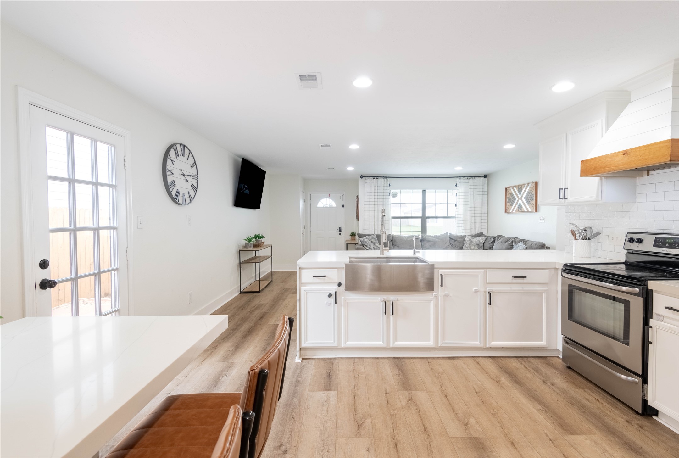 2031 7th Street Hempstead, TX 77445 - Photo 7 of 30 a large white kitchen with a large window
