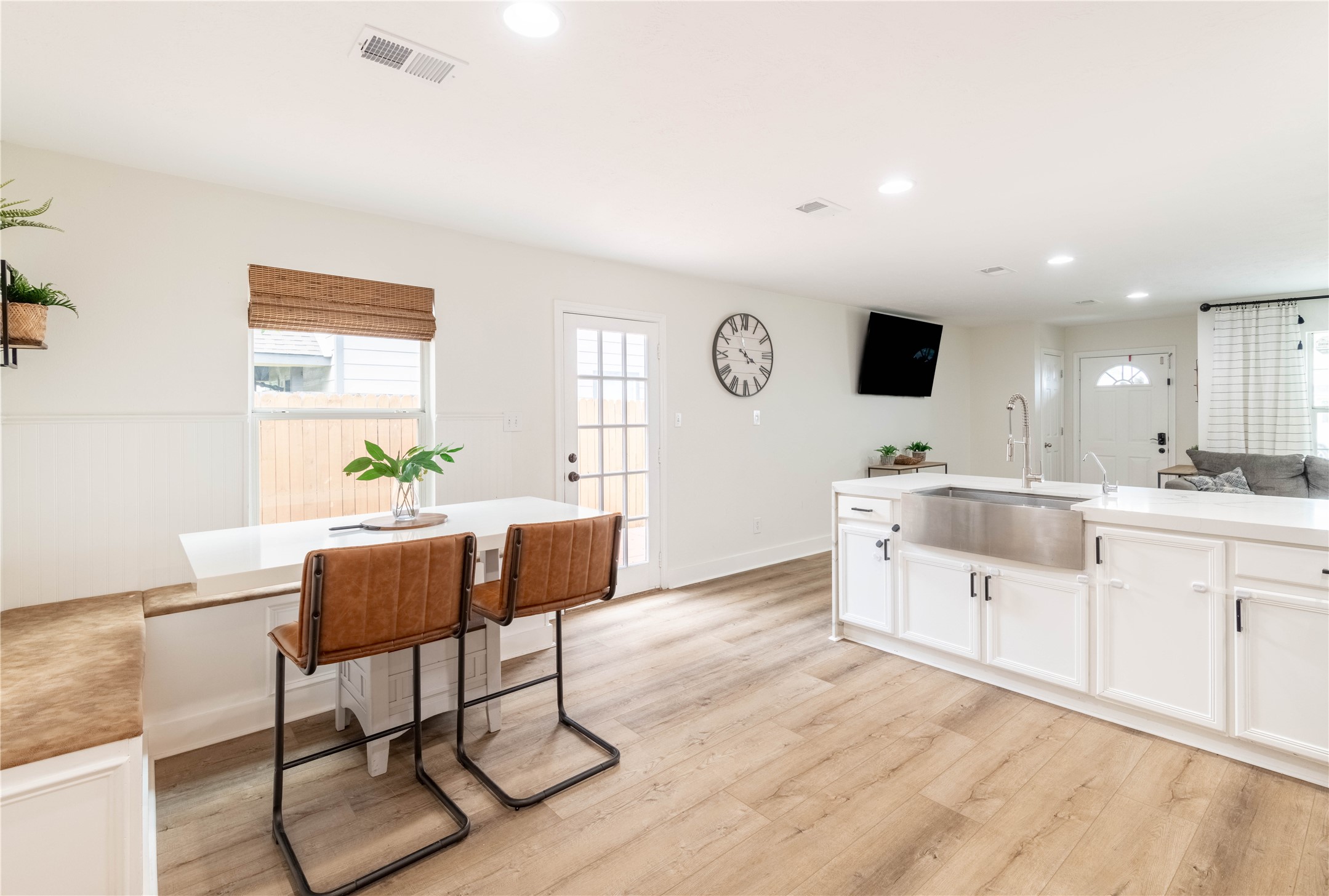 2031 7th Street Hempstead, TX 77445 - Photo 8 of 30 a living room with furniture a flat screen tv and kitchen view
